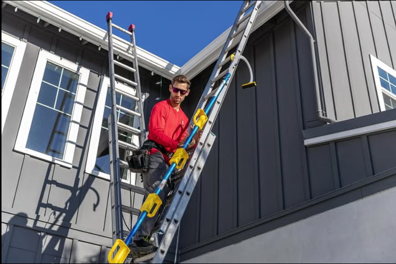 clark partridge climbing ladders during christmas lights instatllations in sacramento