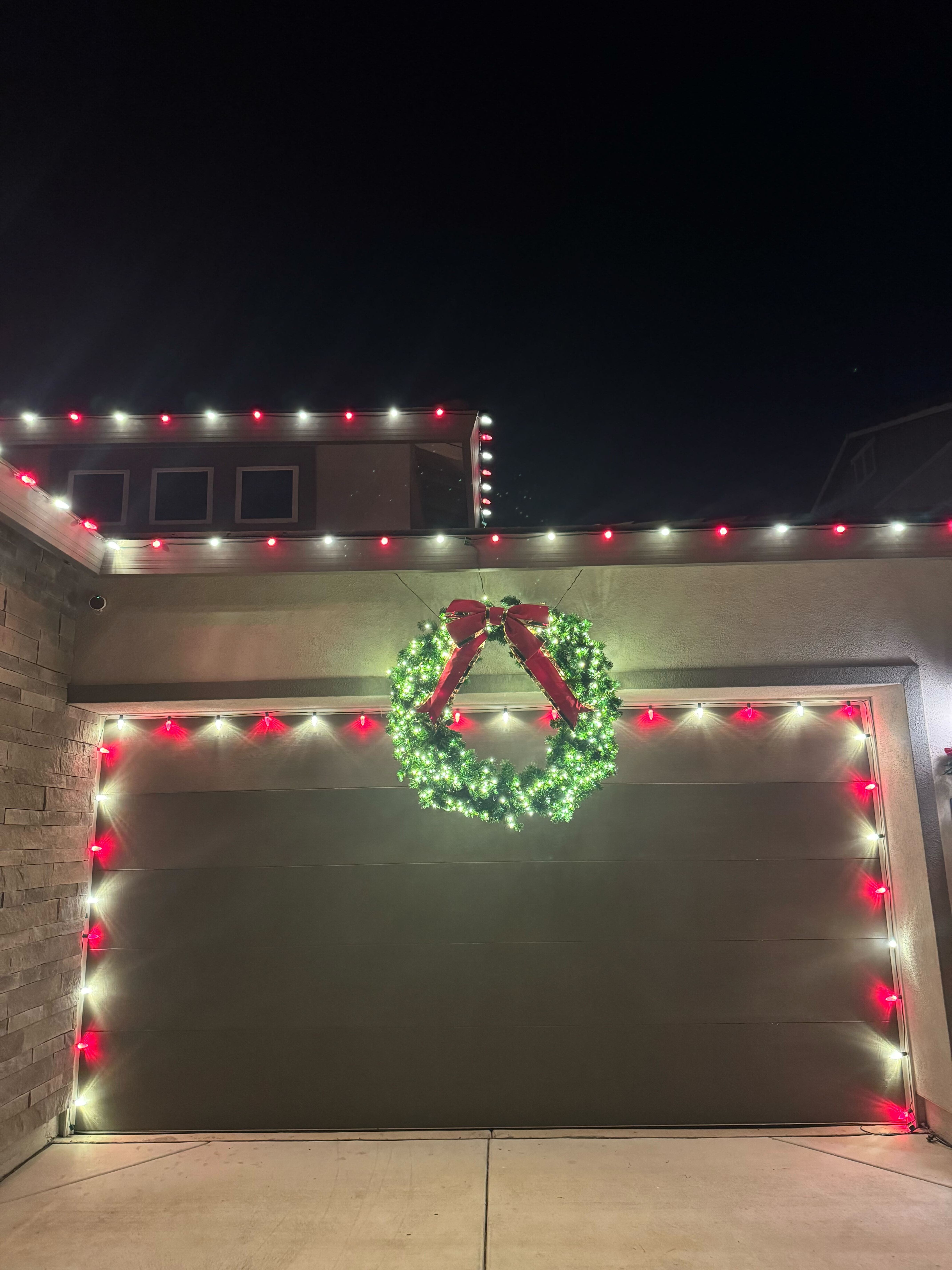 Wreath installed on top of a garage door