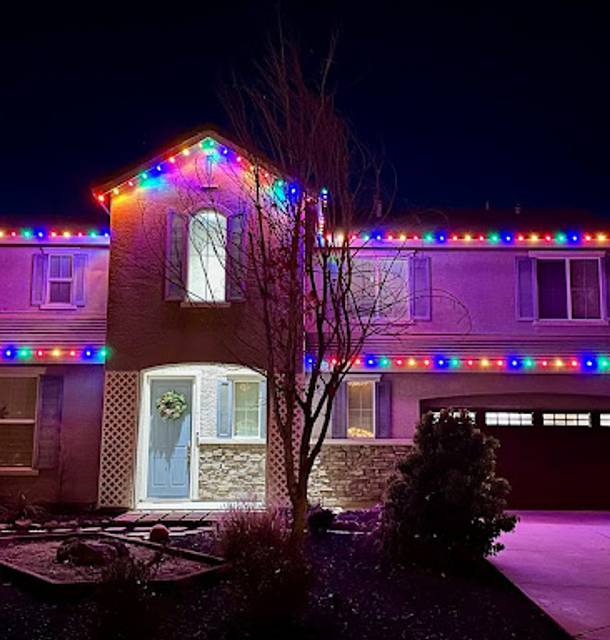 christmas lights installation on a house