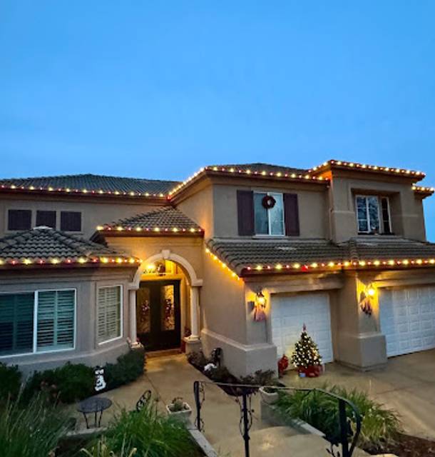 christmas lights installation on a house