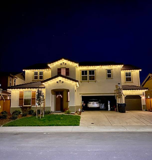 christmas lights installation on a house